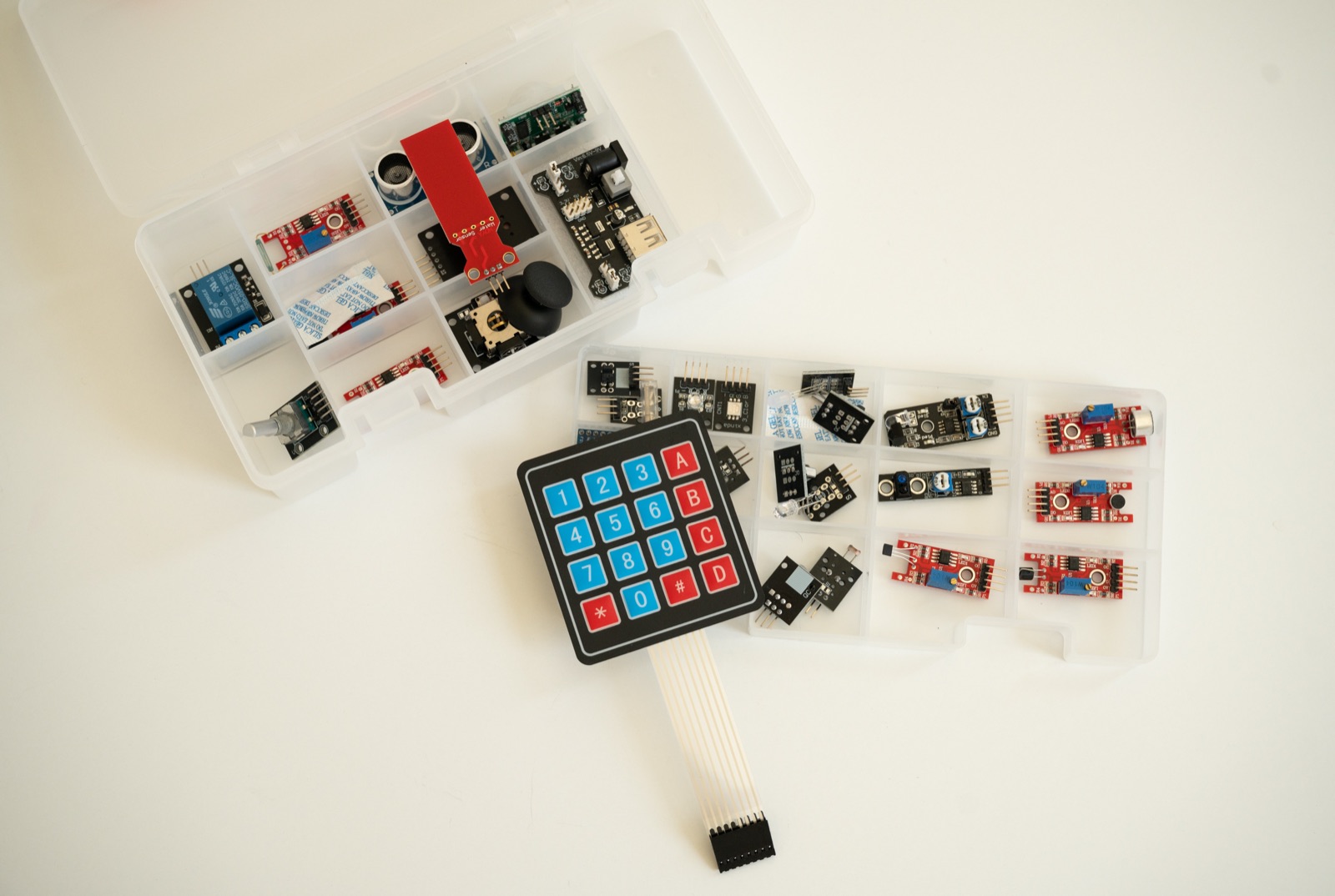 Sorted cases of sensor modules and a membrane keypad included in the kit