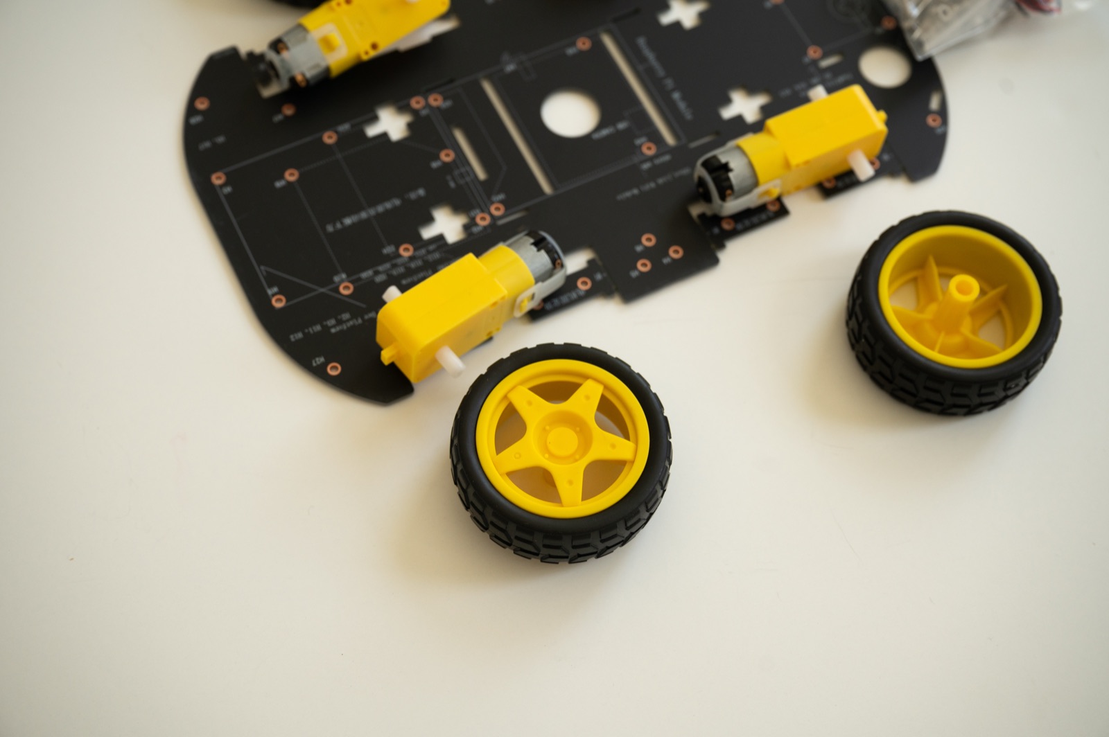 Close-up of the robot car wheels and DC gear motors